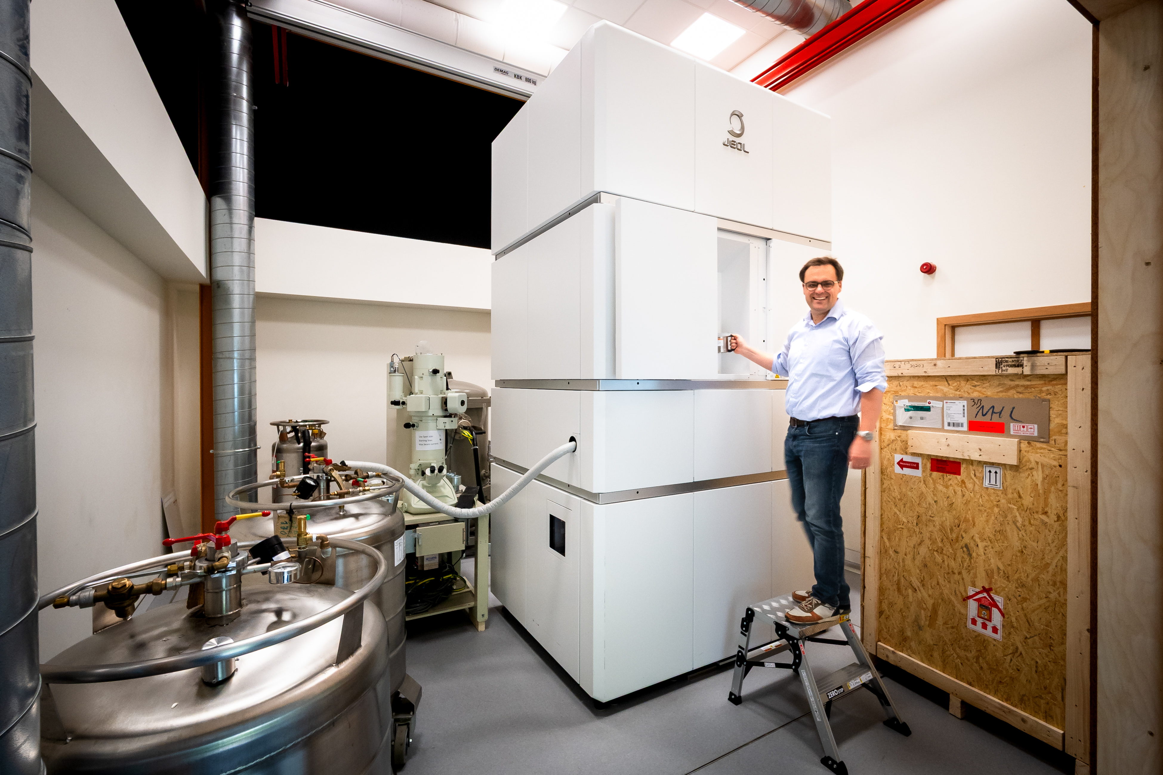 BCEM researcher next to giant microscope