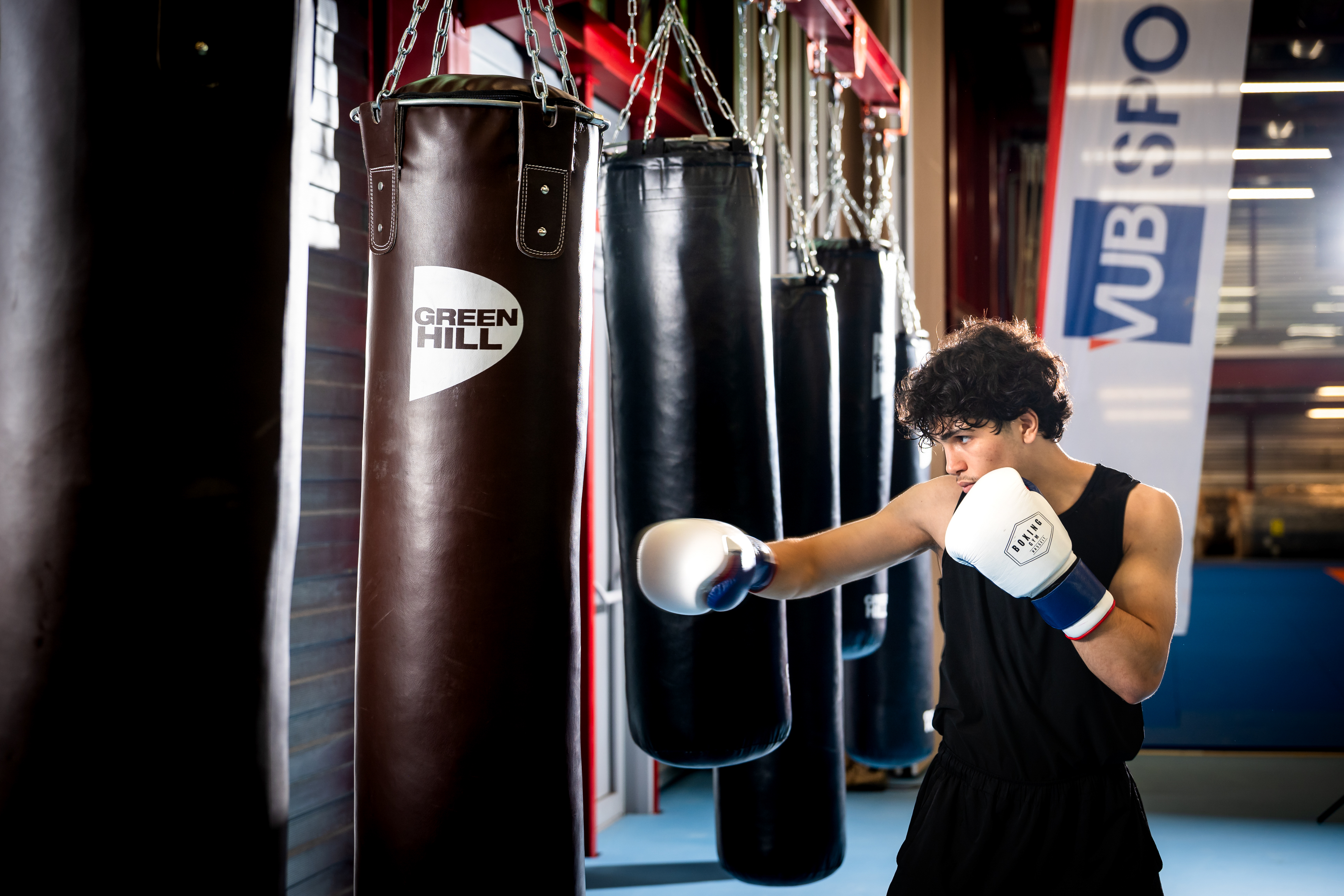 Boxer hits punching bag